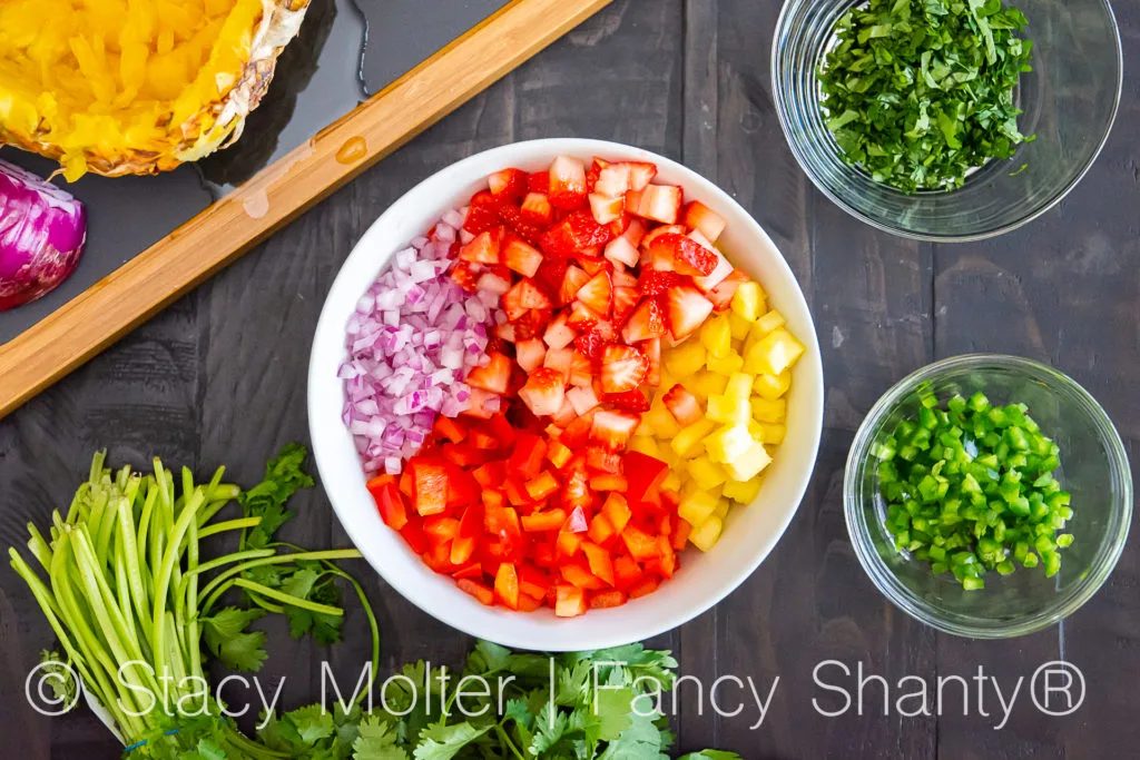 This Strawberry Pineapple Salsa recipe is a delightful twist on a traditional salsa recipe that incorporates the flavors of sweet strawberries and tropical pineapple. The contrast of the sweet fruits with the savory ingredients like red onion and jalapeno pepper makes it an appealing dish for a wide range of palates.