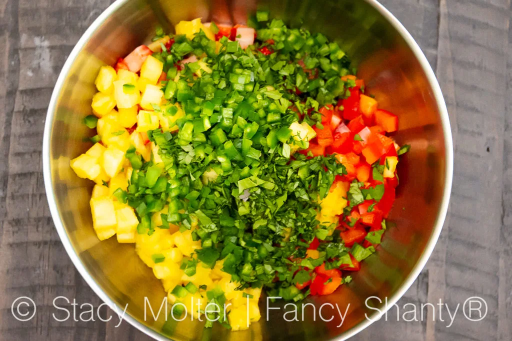 This Strawberry Pineapple Salsa recipe is a delightful twist on a traditional salsa recipe that incorporates the flavors of sweet strawberries and tropical pineapple. The contrast of the sweet fruits with the savory ingredients like red onion and jalapeno pepper makes it an appealing dish for a wide range of palates.