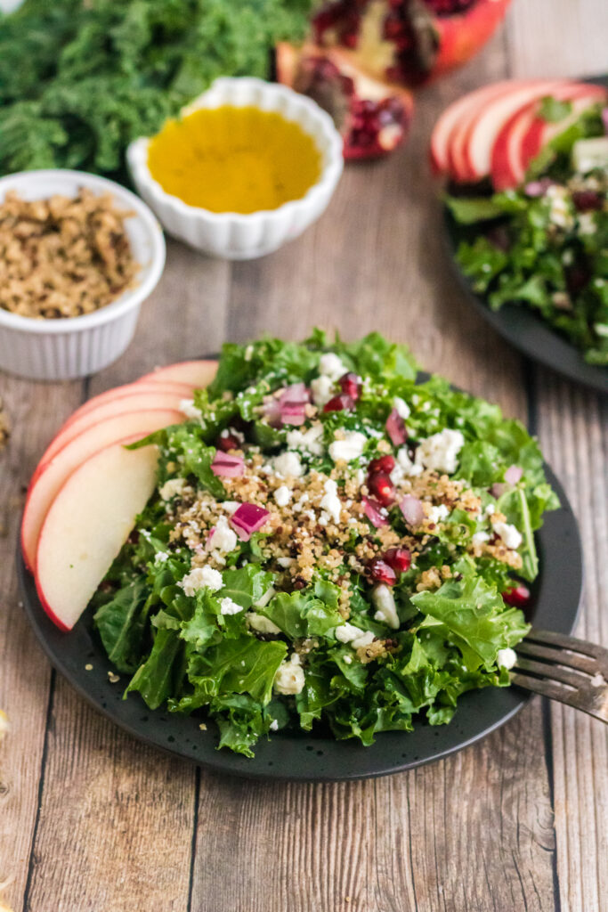 Words cannot describe how delicious this kale and quinoa salad is. Fresh kale leaves are topped with sweet crisp apples, nutritious quinoa, feta cheese, and pomegranate perils, then topped with a simple lemon dressing creating a delicious salad anytime of year!