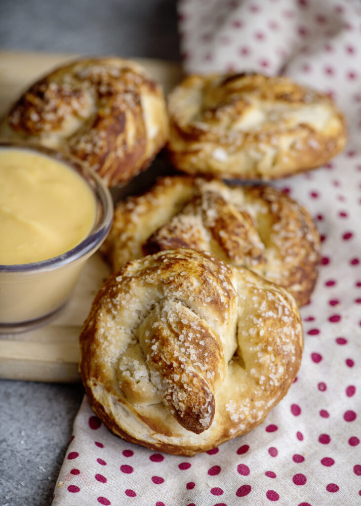 These biscuit pretzels are our favorite easy homemade soft pretzel recipe. They come hot and fresh from the oven with a side of warm, gooey cheese. Life just got better. You can thank me later.
