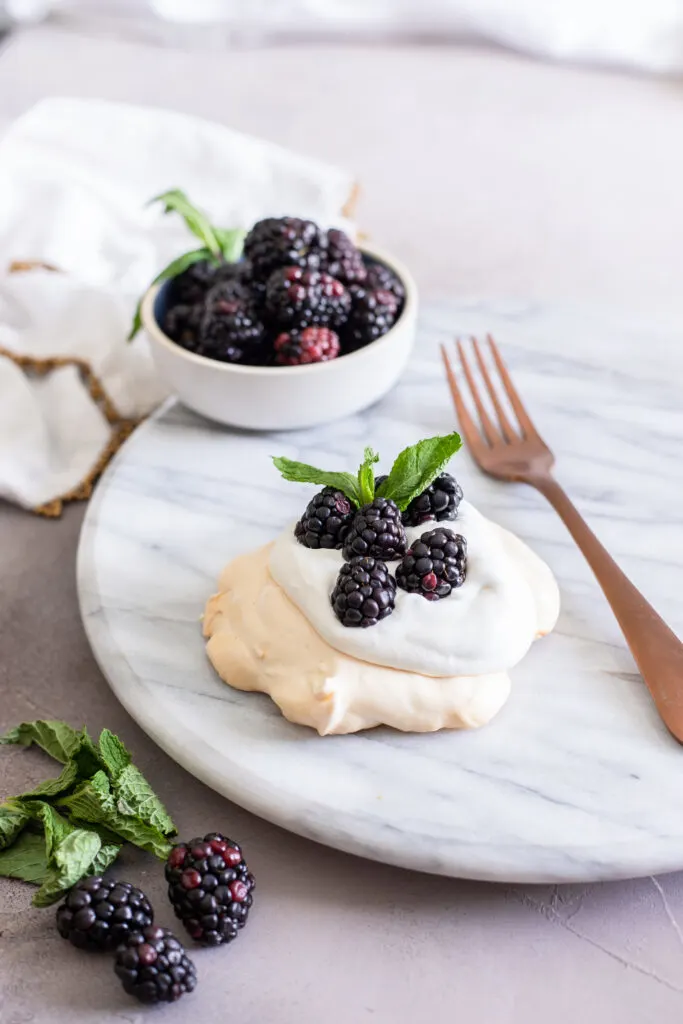 This mini blackberry pavlova recipes is the perfect summer dessert, crisp on the outside and marshmallow soft inside.

Top with your favorite whipped cream and fresh fruit for a show-stopping meringue dessert everyone will love.